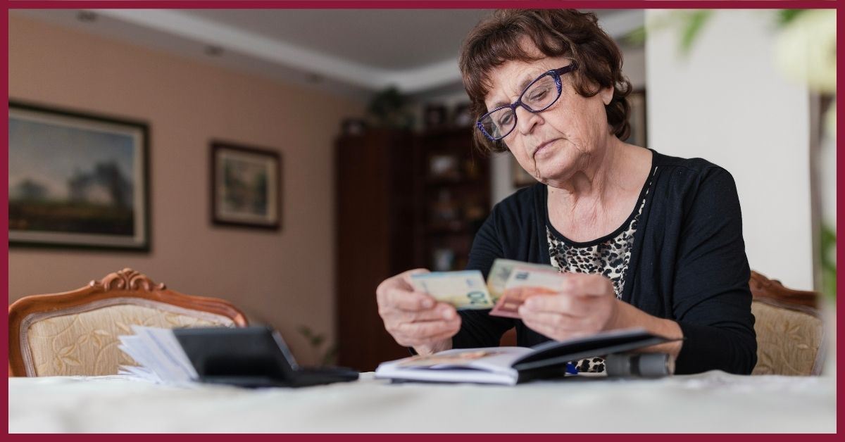 old woman looking at finances